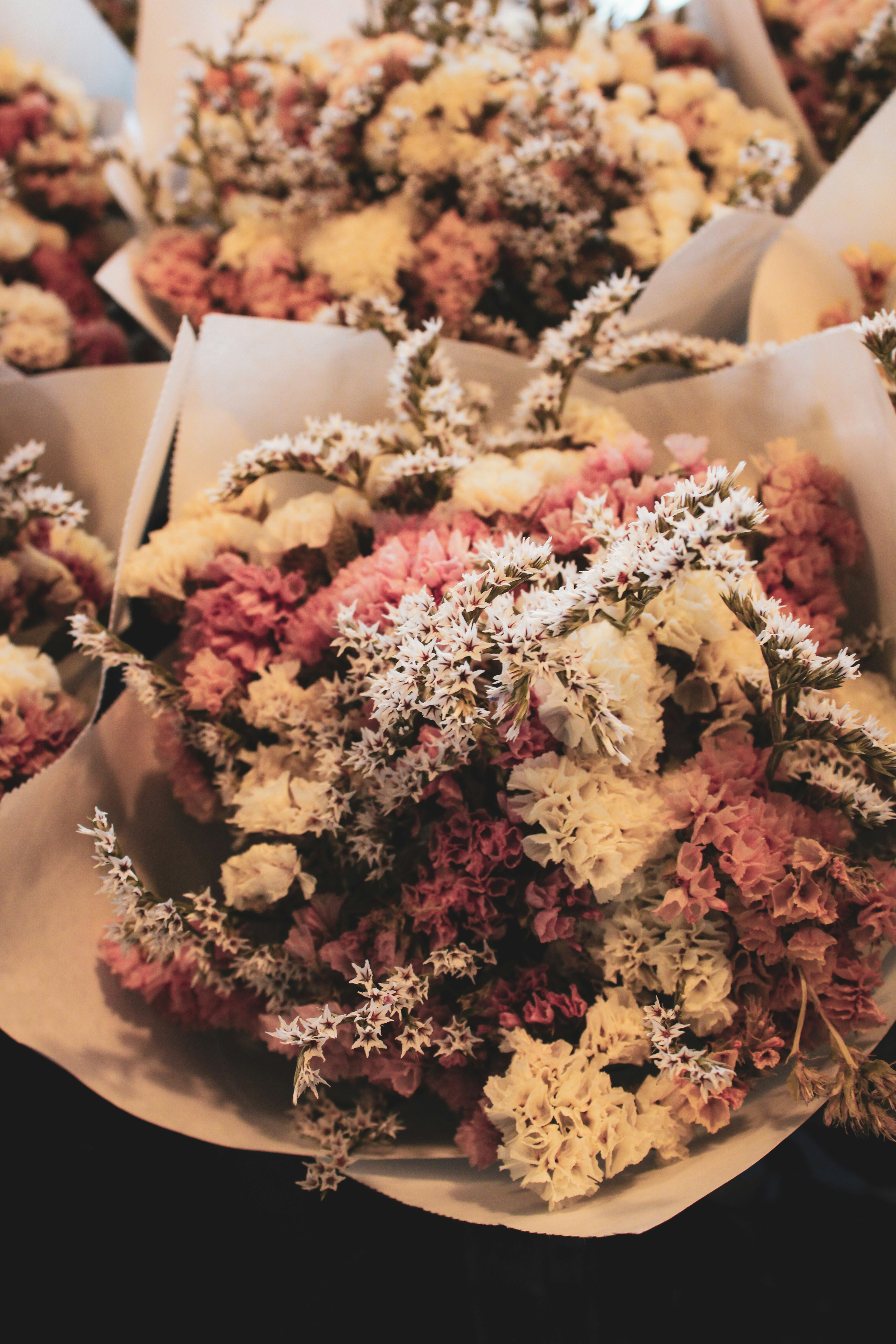 a bunch of flowers that are sitting on a table