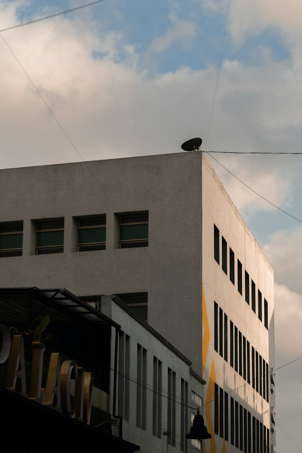 a tall building with a sky in the background