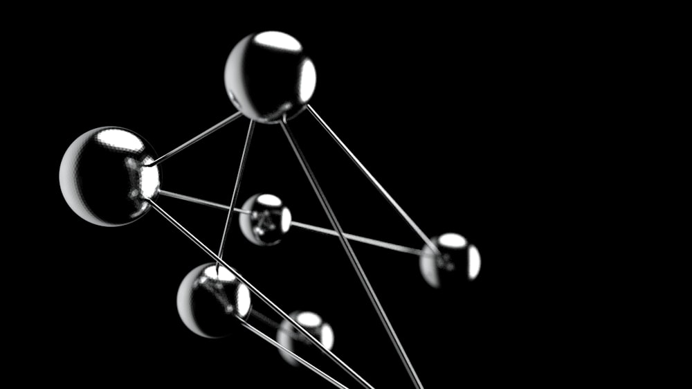 a black and white photo of a group of spheres
