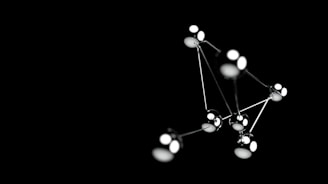 a black and white photo of a cluster of lights