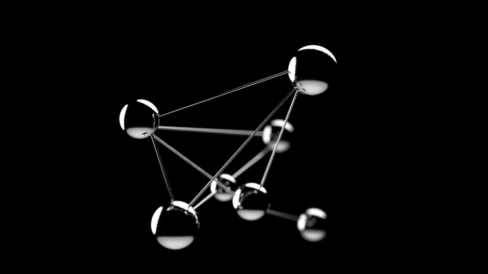 a black and white photo of a network of spheres