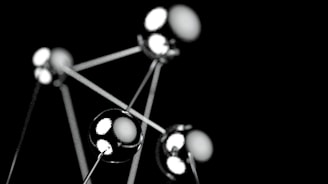 a black and white photo of a bunch of balls