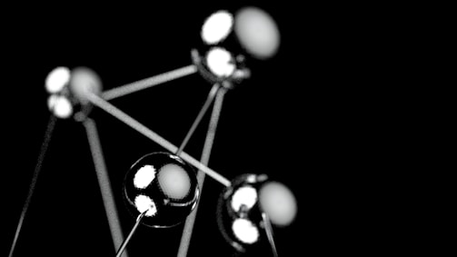 a black and white photo of a bunch of balls