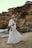 a woman standing on top of a sandy beach
