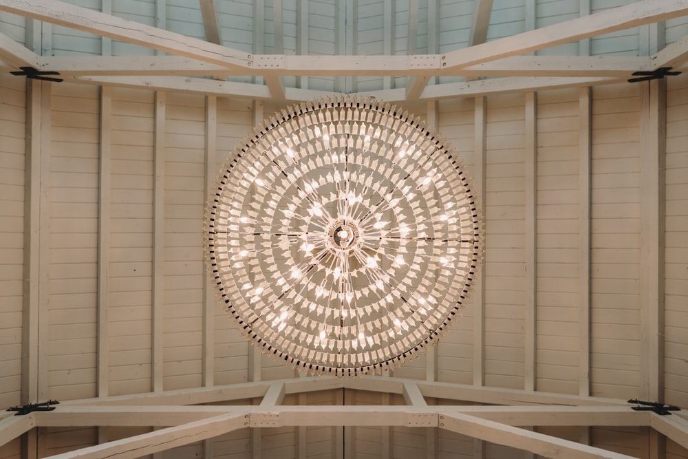 a circular light hanging from the ceiling of a building