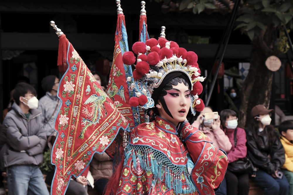 a woman dressed in a costume and headdress