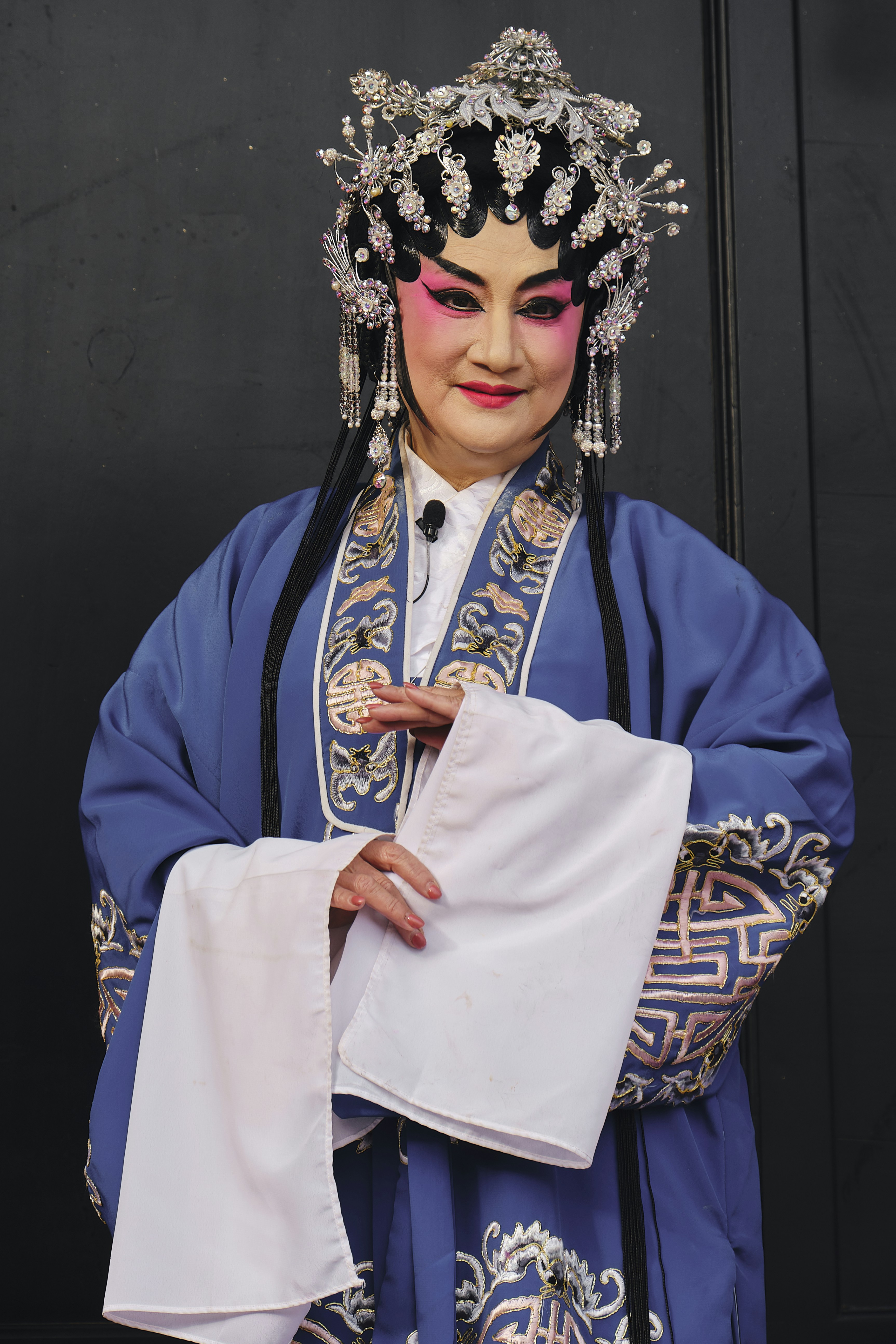 a woman wearing a blue and white costume