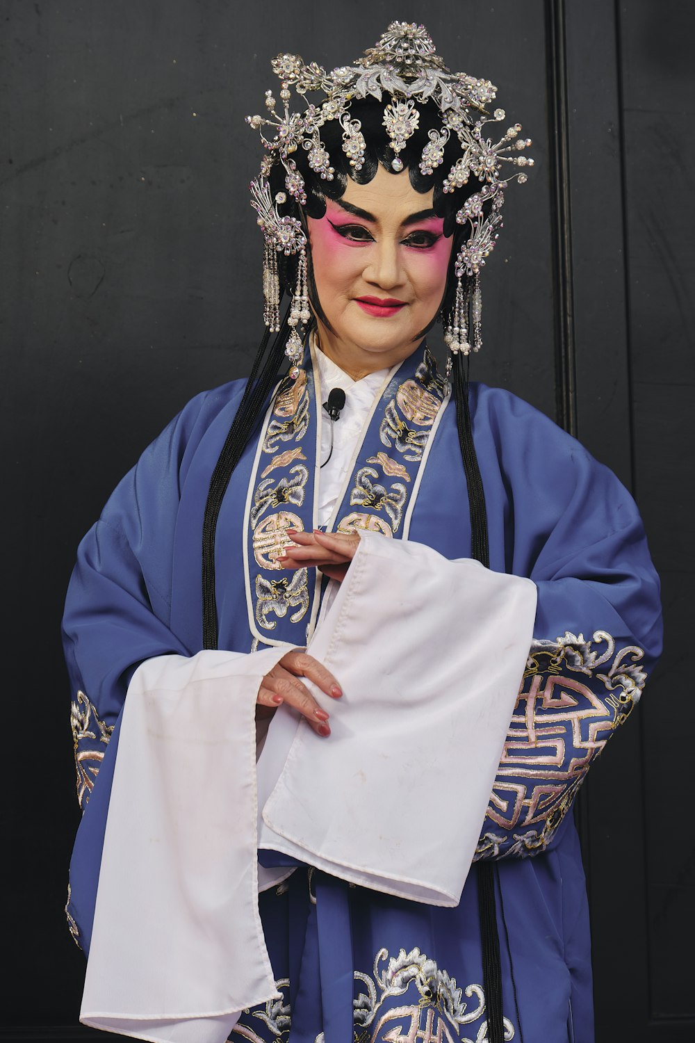 a woman wearing a blue and white costume