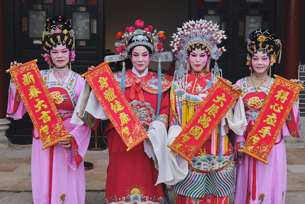 a group of people dressed in oriental costumes