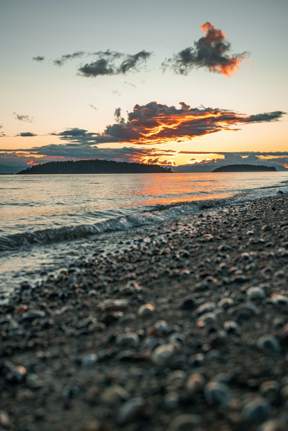 a beach that has a bunch of rocks on it