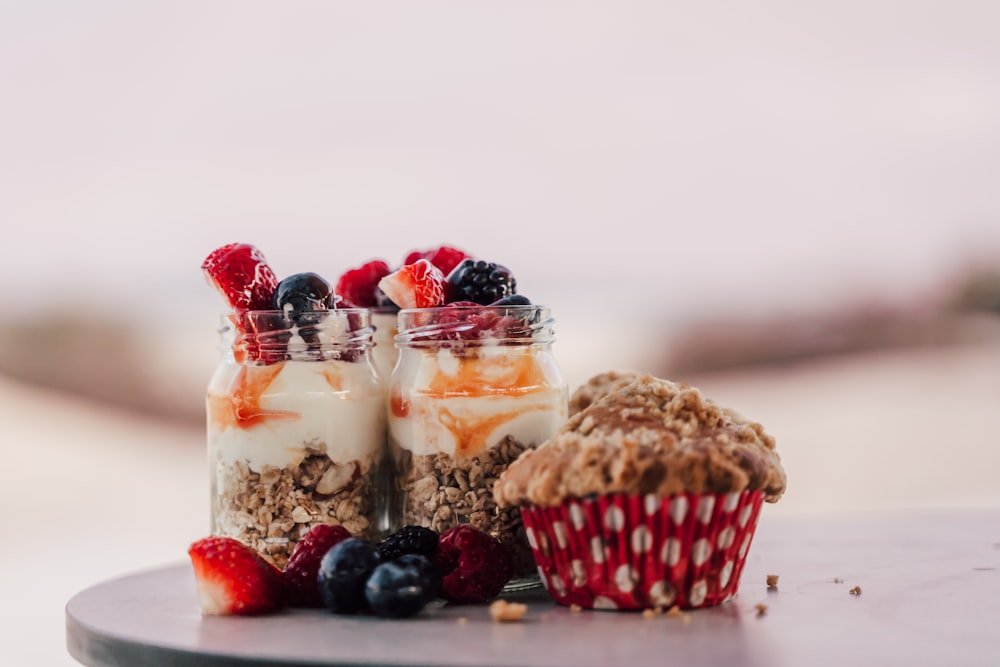 a couple of desserts sitting on top of a table