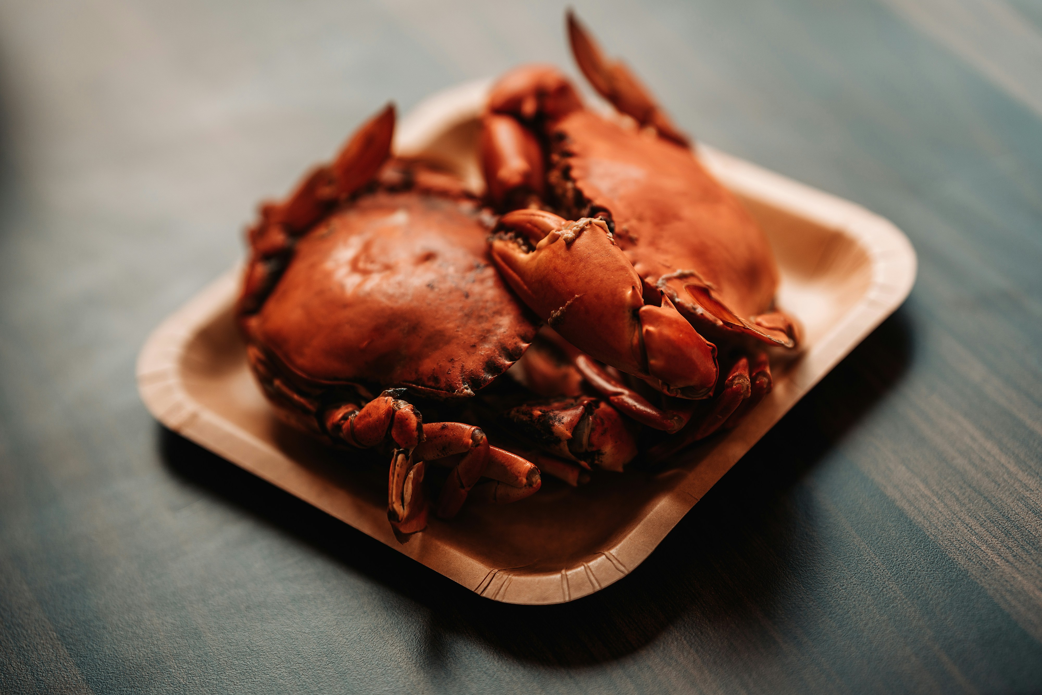 a close up of a plate of crabs on a table