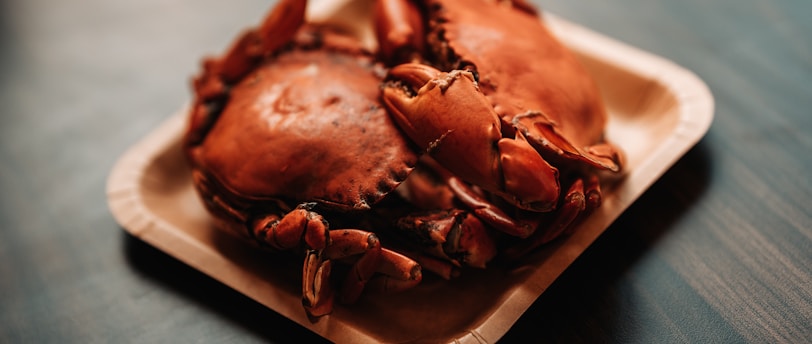 a close up of a plate of crabs on a table