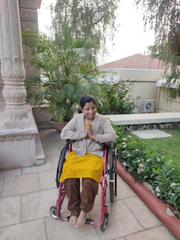 A compassionate caregiver assisting a person with a disability in a bright, welcoming home environment