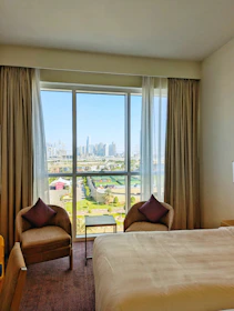 a hotel room with a view of the city