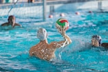 a group of people playing a game of water polo
