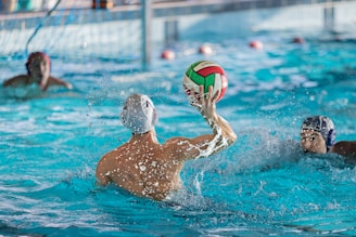 a group of people playing a game of water polo