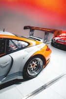 A sleek wheel alignment system bathed in warm yellow ochre lighting.