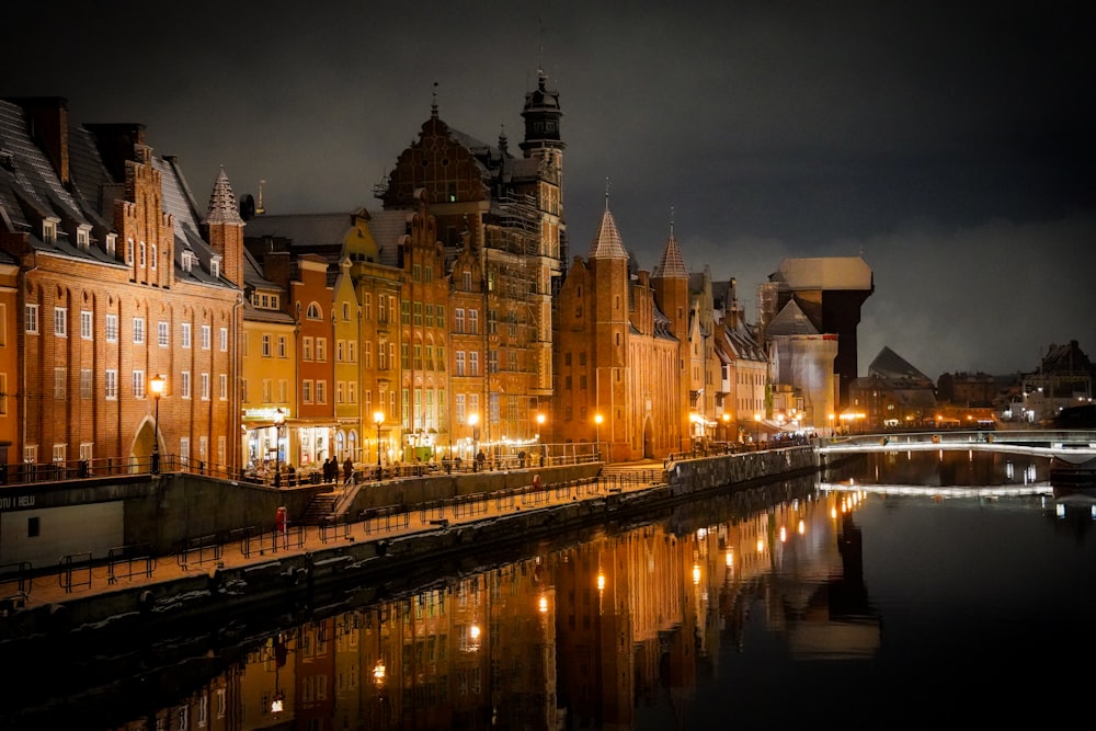 a river running through a city next to tall buildings