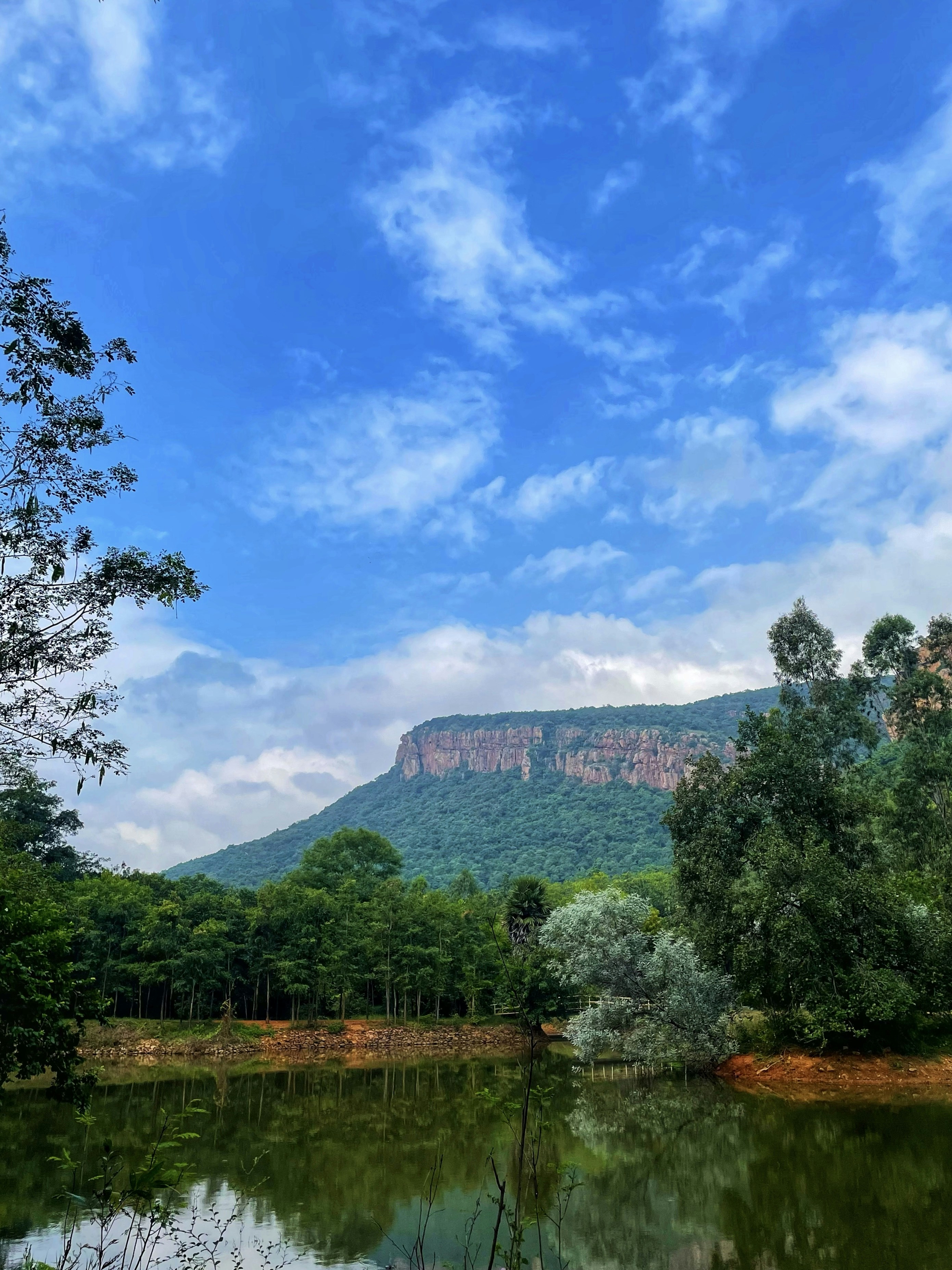 a lake with a mountain in the background