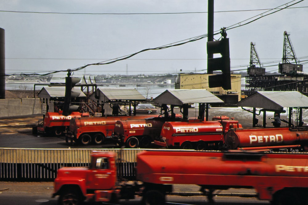 a group of red trucks parked next to each other