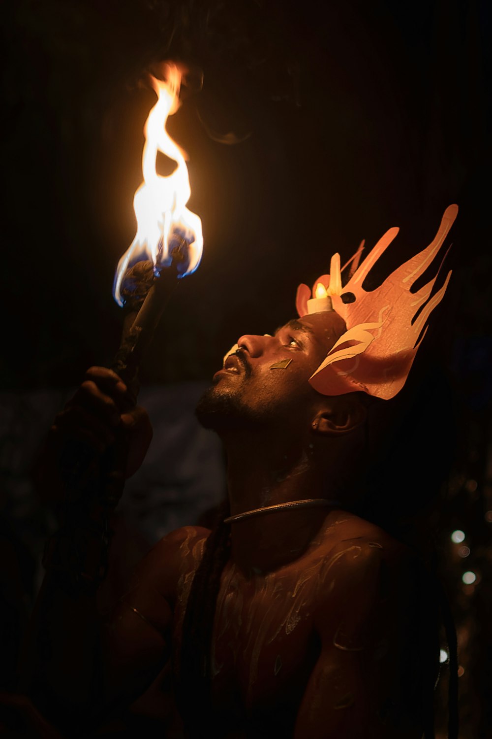 a man holding a torch in his hand