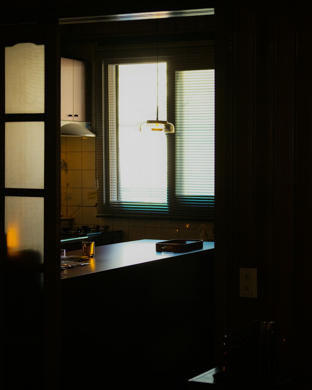 a kitchen with a counter and a window