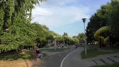 Families enjoying recreational areas with playgrounds.