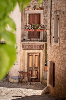 a couple of chairs sitting outside of a building