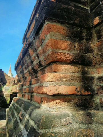 Close-up of ancient stone bricks showing the weathered texture of the Great Wall.