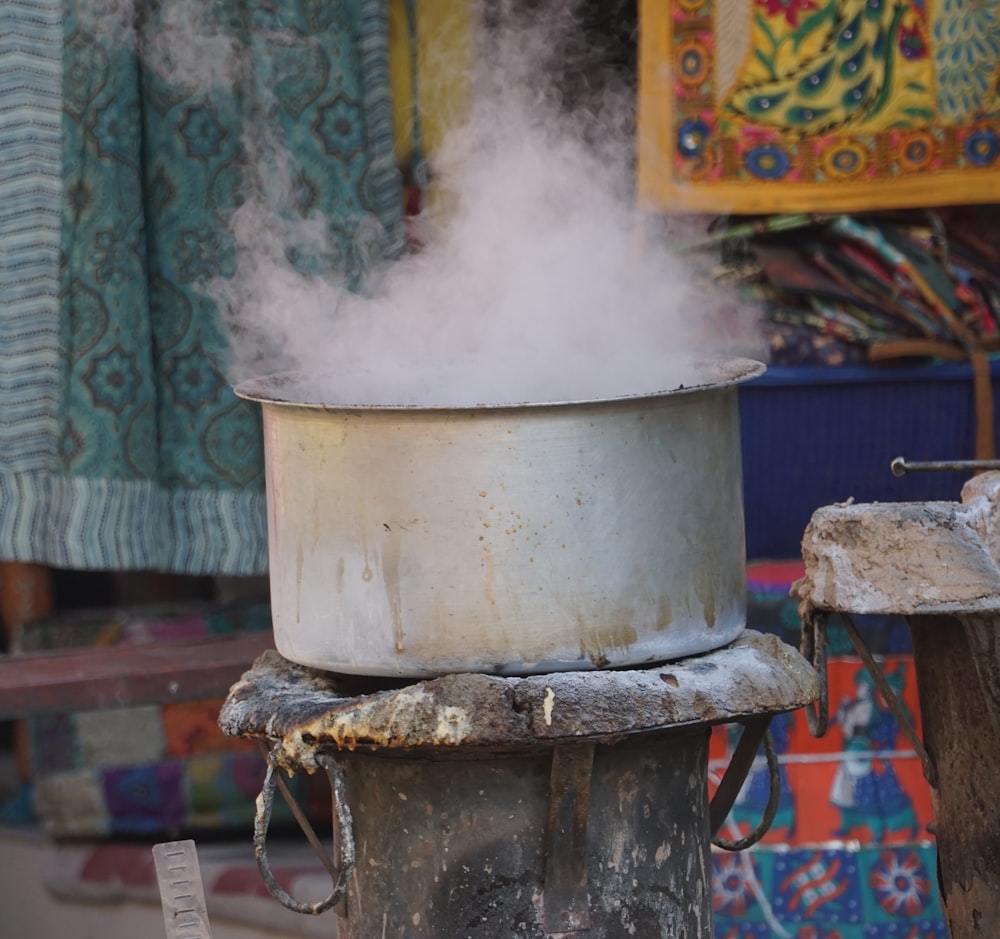 a pot with steam coming out of it