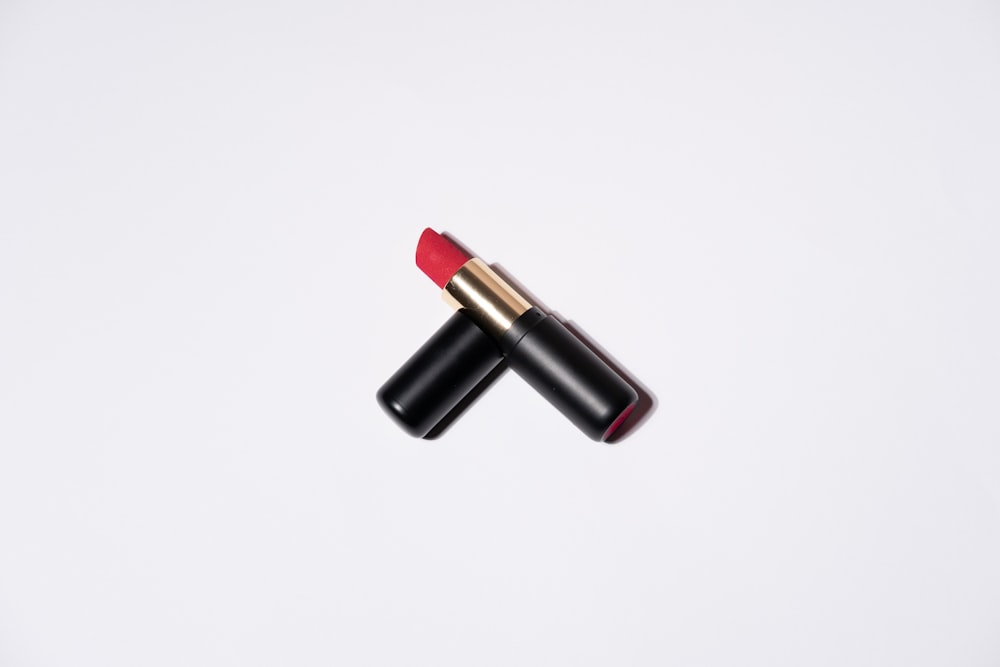two red lipsticks on a white background