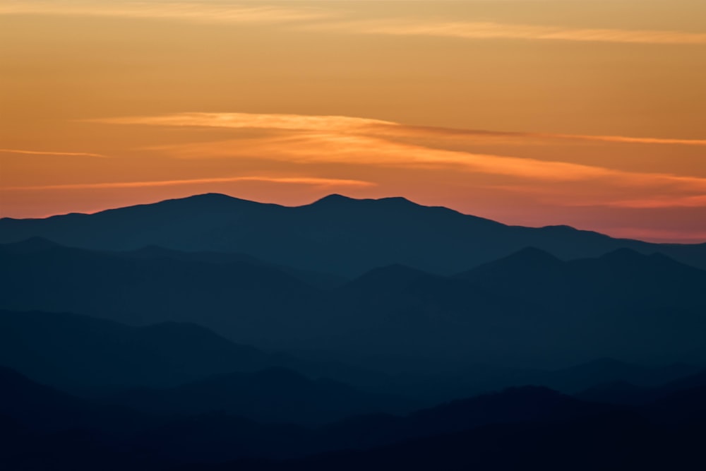 a view of a mountain range at sunset