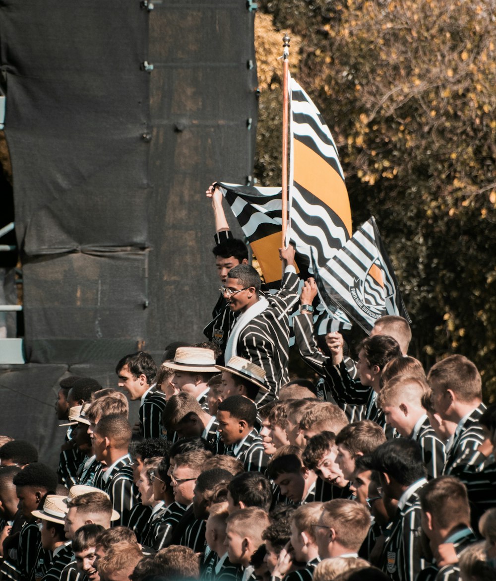 a group of people standing around each other