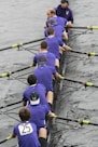 a group of men sitting on top of a boat in the water