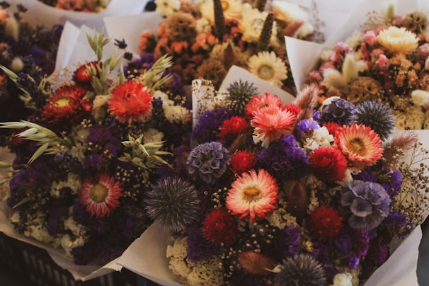 a bunch of flowers that are sitting on a table