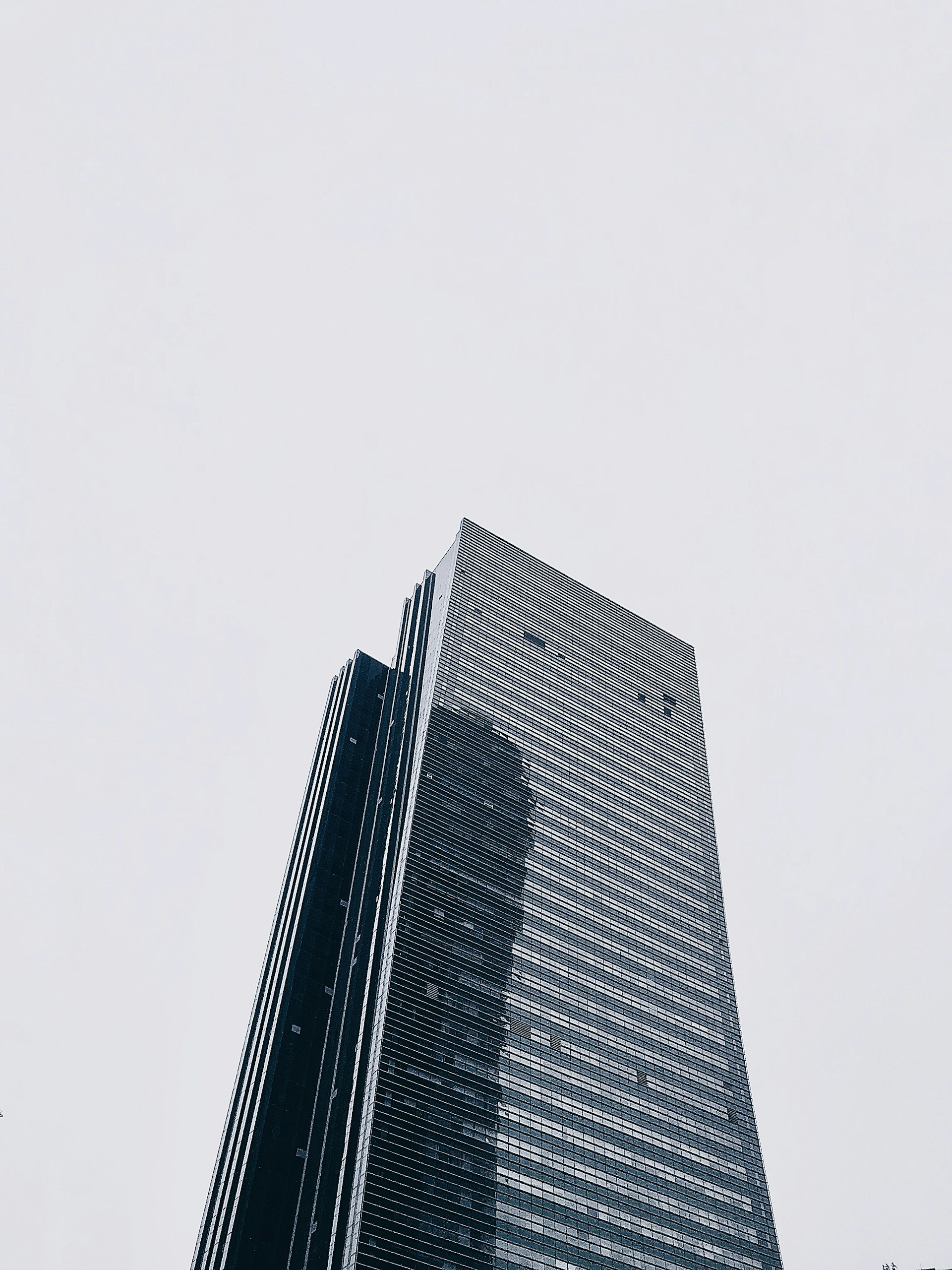 a very tall building towering over a city