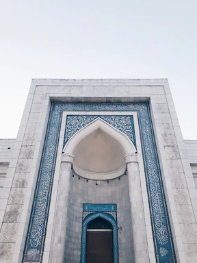 Elegant traditional building entrance with deep blue and gold accents symbolizing community heritage.