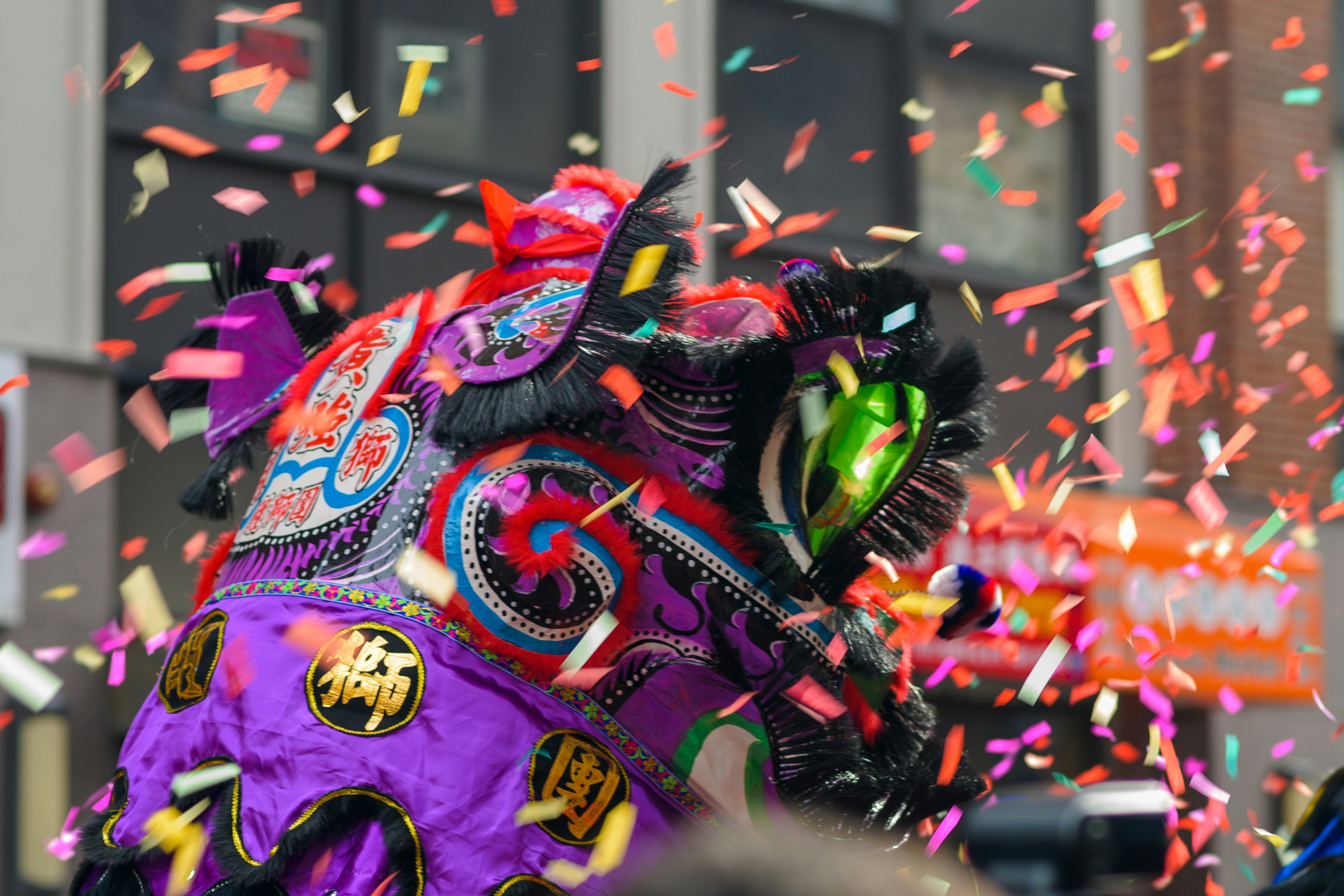 a colorful elephant is surrounded by confetti and streamers