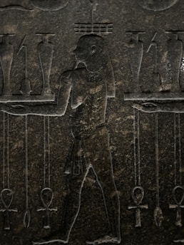 Ancient statue of a Mesopotamian deity surrounded by mystical symbols.