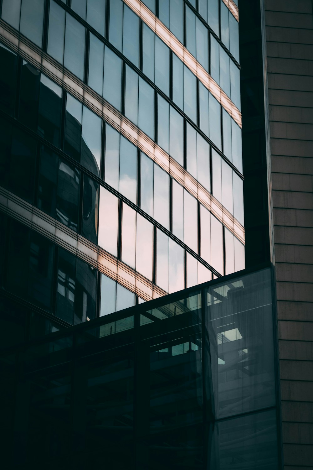 a tall building with lots of windows next to it