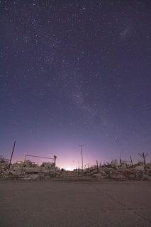 Pixel art scene showing a mysterious ruined temple with glowing symbols under a twilight sky.