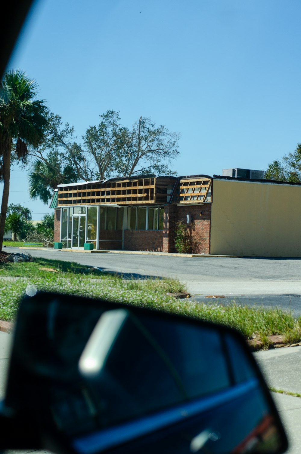 a car is parked in front of a building