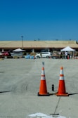 A delivery truck unloading portable toilets at a large event space in Tampa.