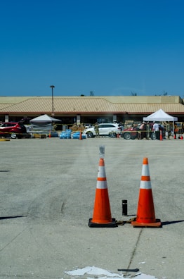 A delivery truck unloading portable toilets at a large event space in Tampa.