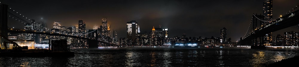 a night scene of a city and a bridge