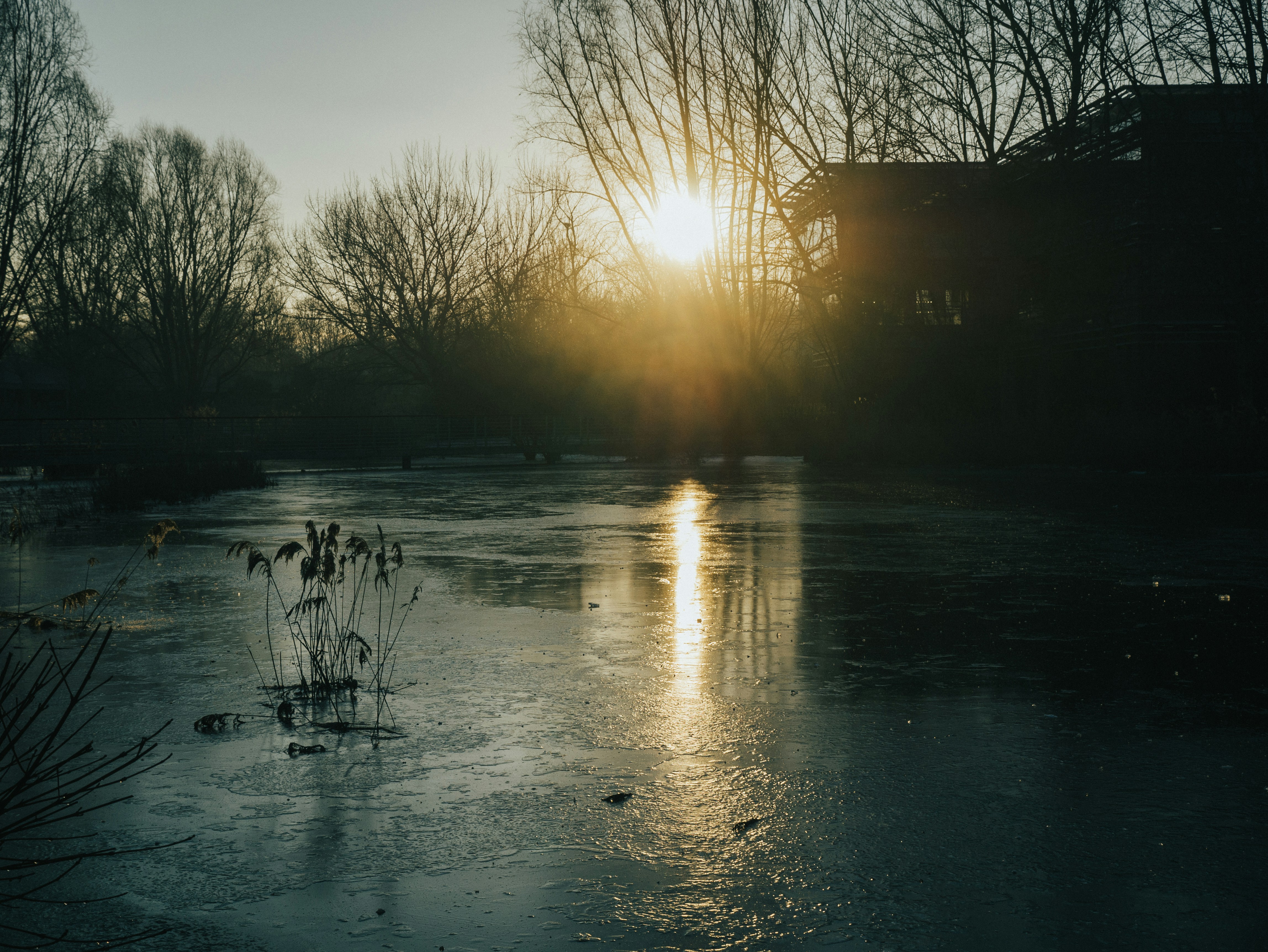 the sun is setting over a body of water