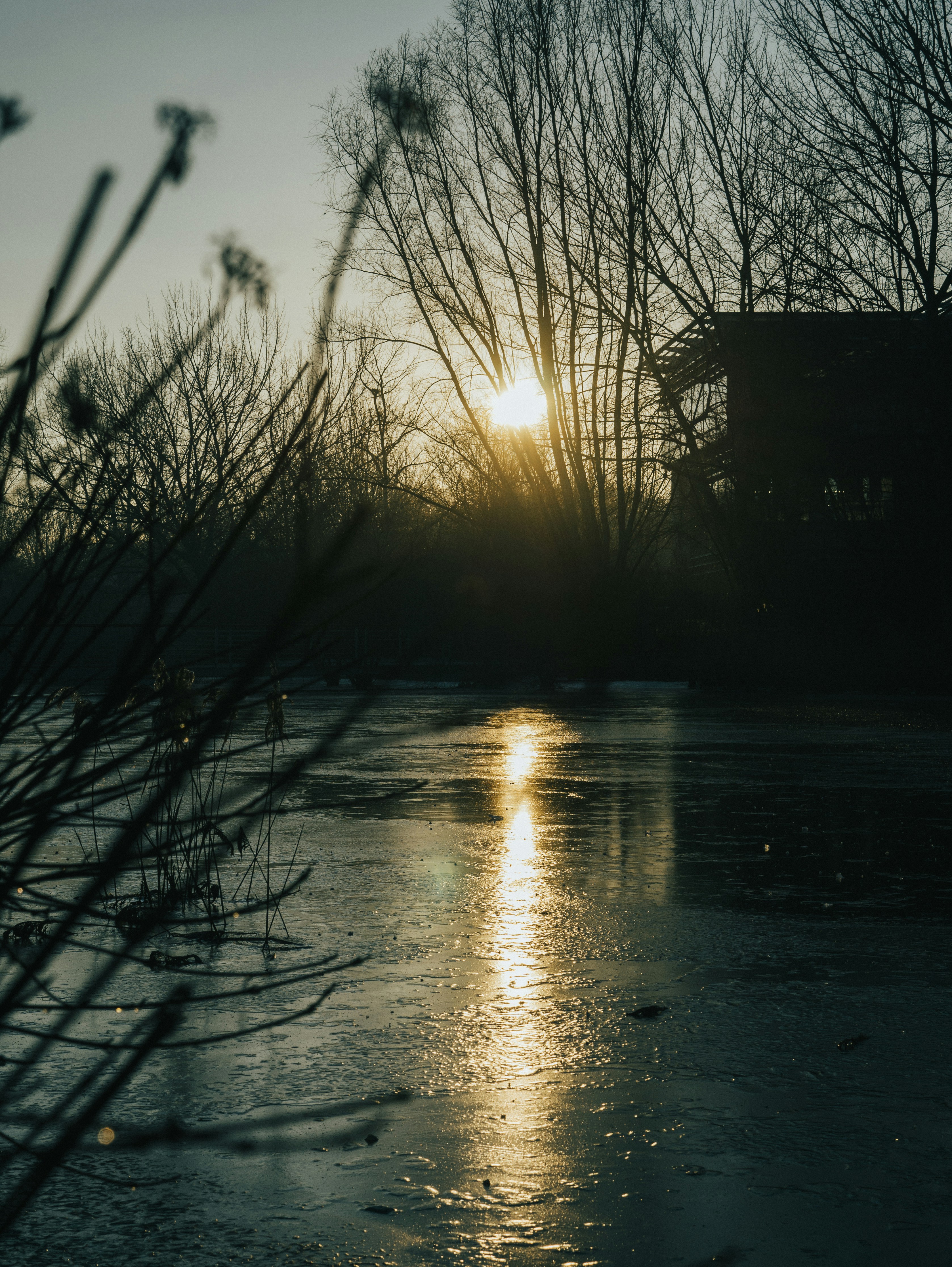 the sun is setting over a body of water