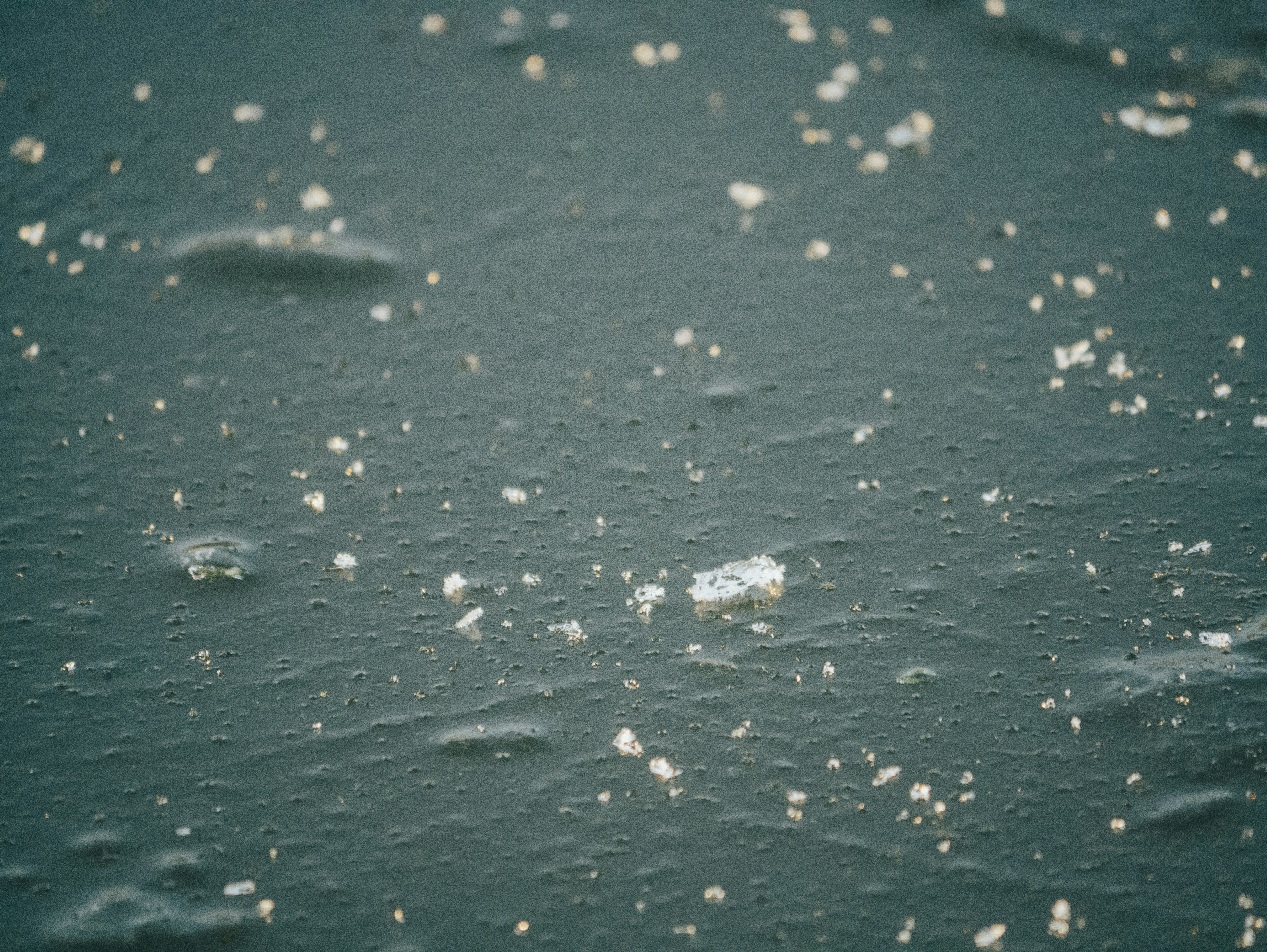 a close up of water droplets on a surface