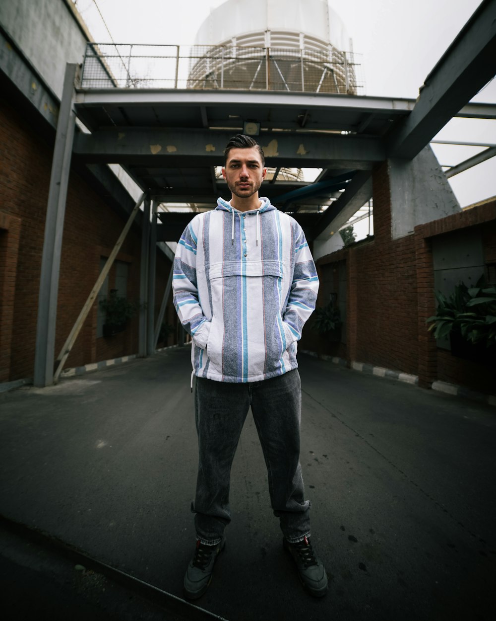 a man standing in front of a building